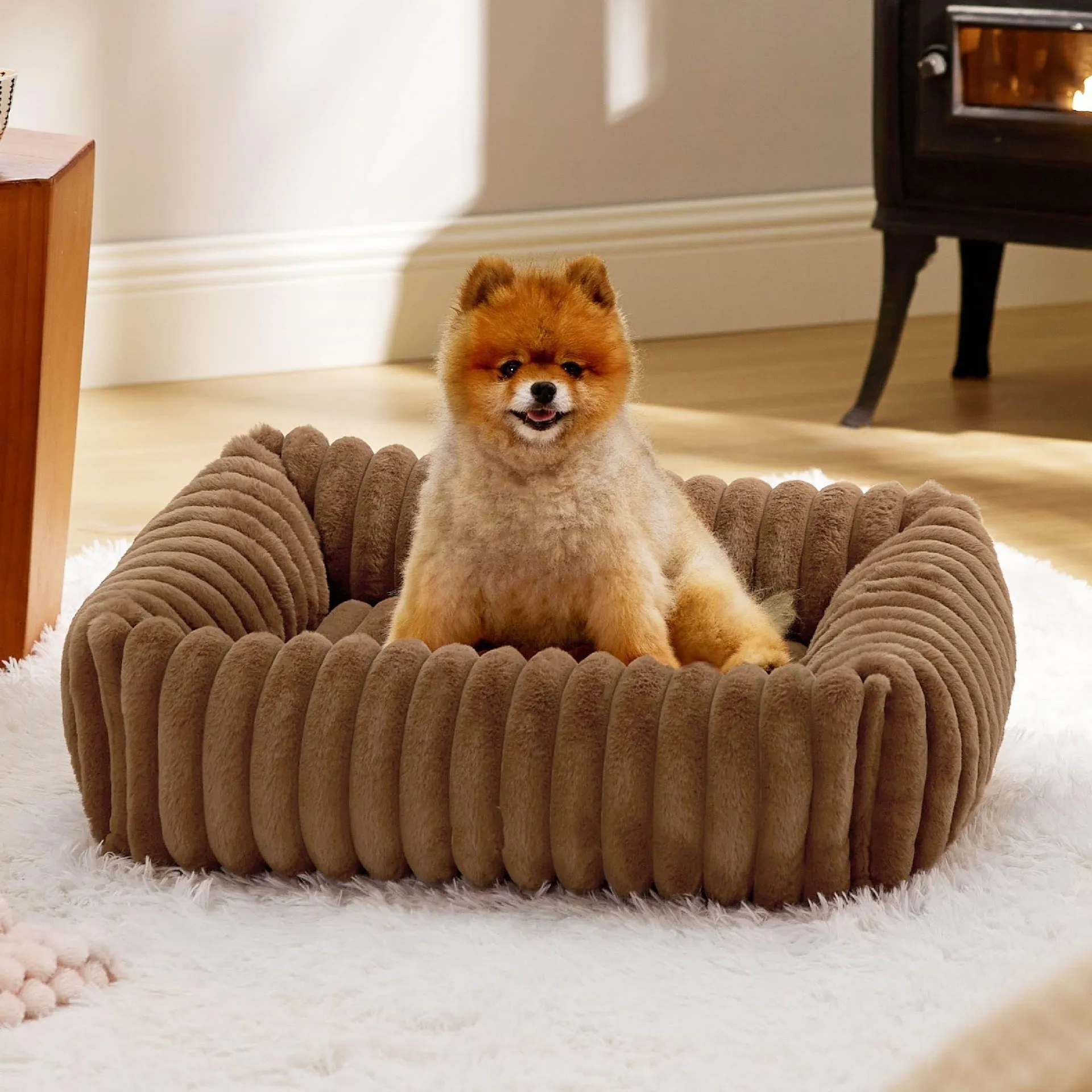 Dog bed with removable cover in beige colour showing four available size options