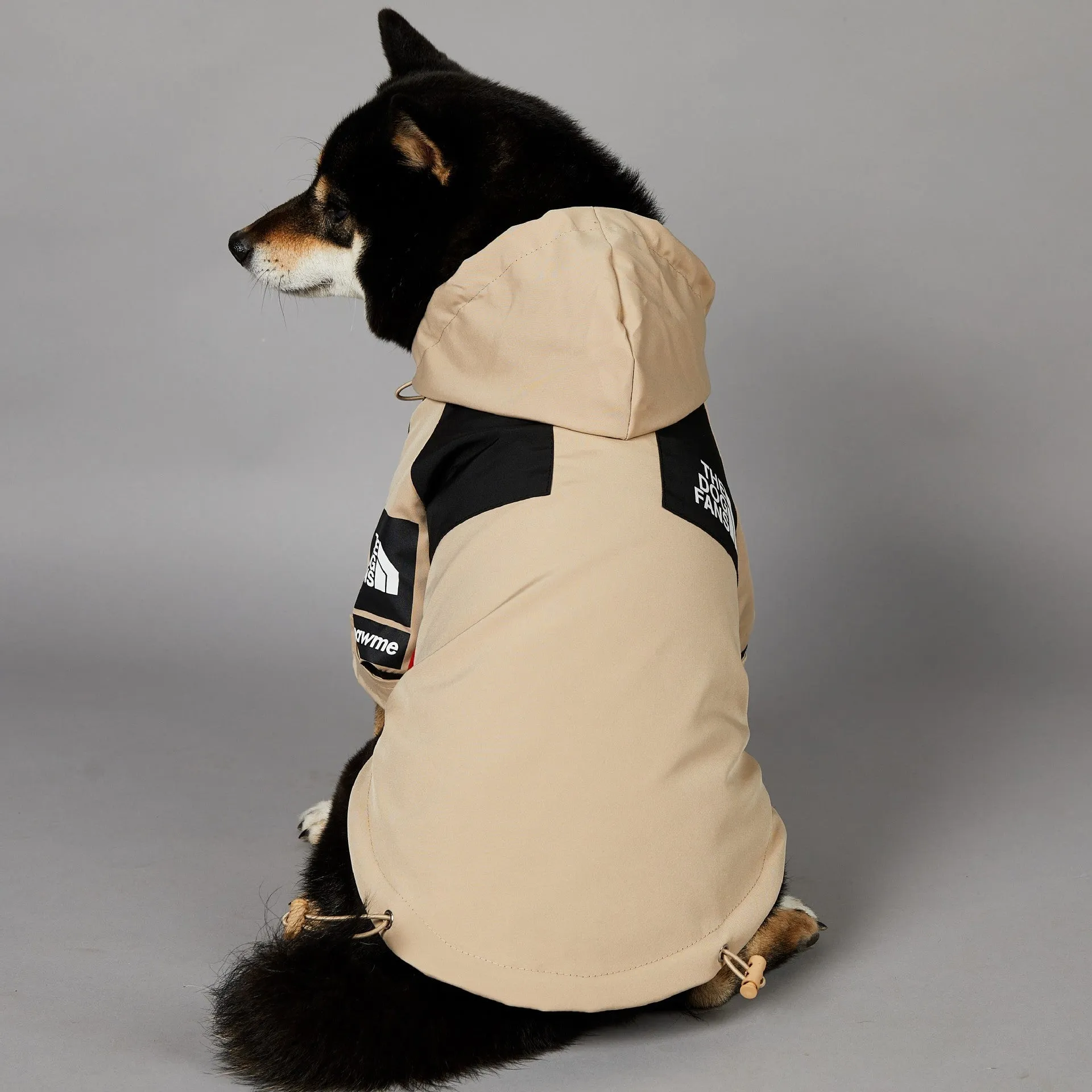 Khaki polyester dog shell jacket showing simple design for canine weather protection
