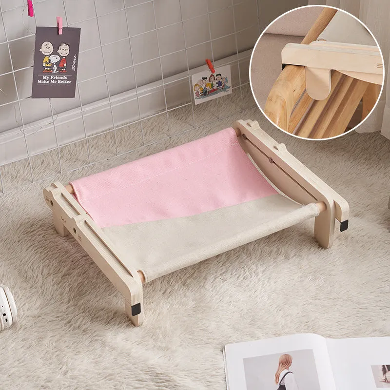 Solid wood cat bed with washable cover in grey-blue colour option on floor