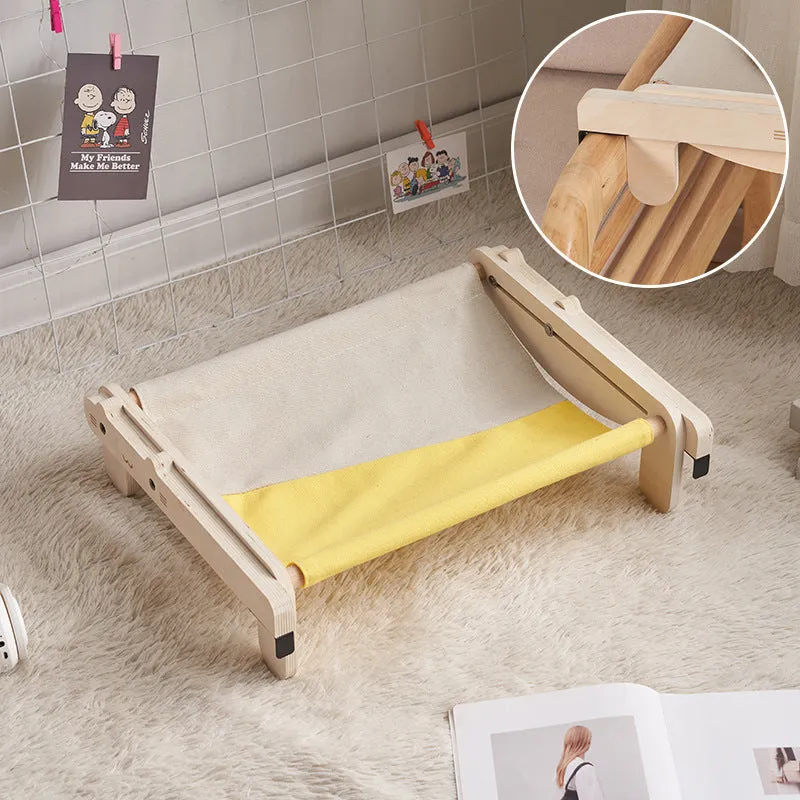 Solid wood cat bed with washable cover in grey-blue colour option on floor