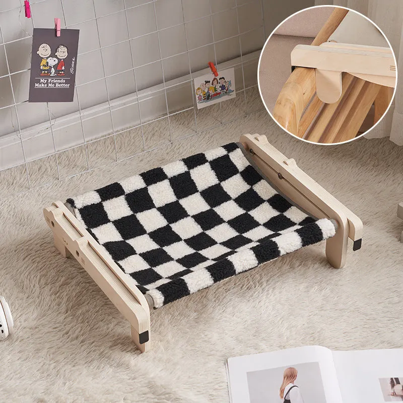 Solid wood cat bed with washable cover in grey-blue colour option on floor