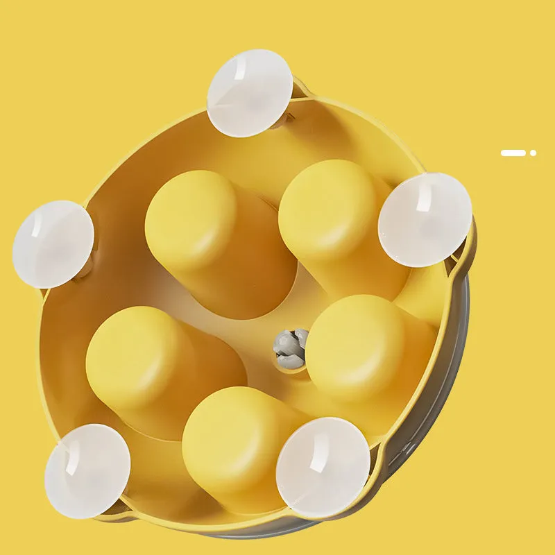Bright yellow interactive cat toy and snack bowl for pet entertainment and feeding.