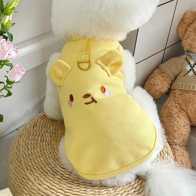 Yellow waffle-knit vest for a small dog on a mannequin, showing casual pet clothing style.