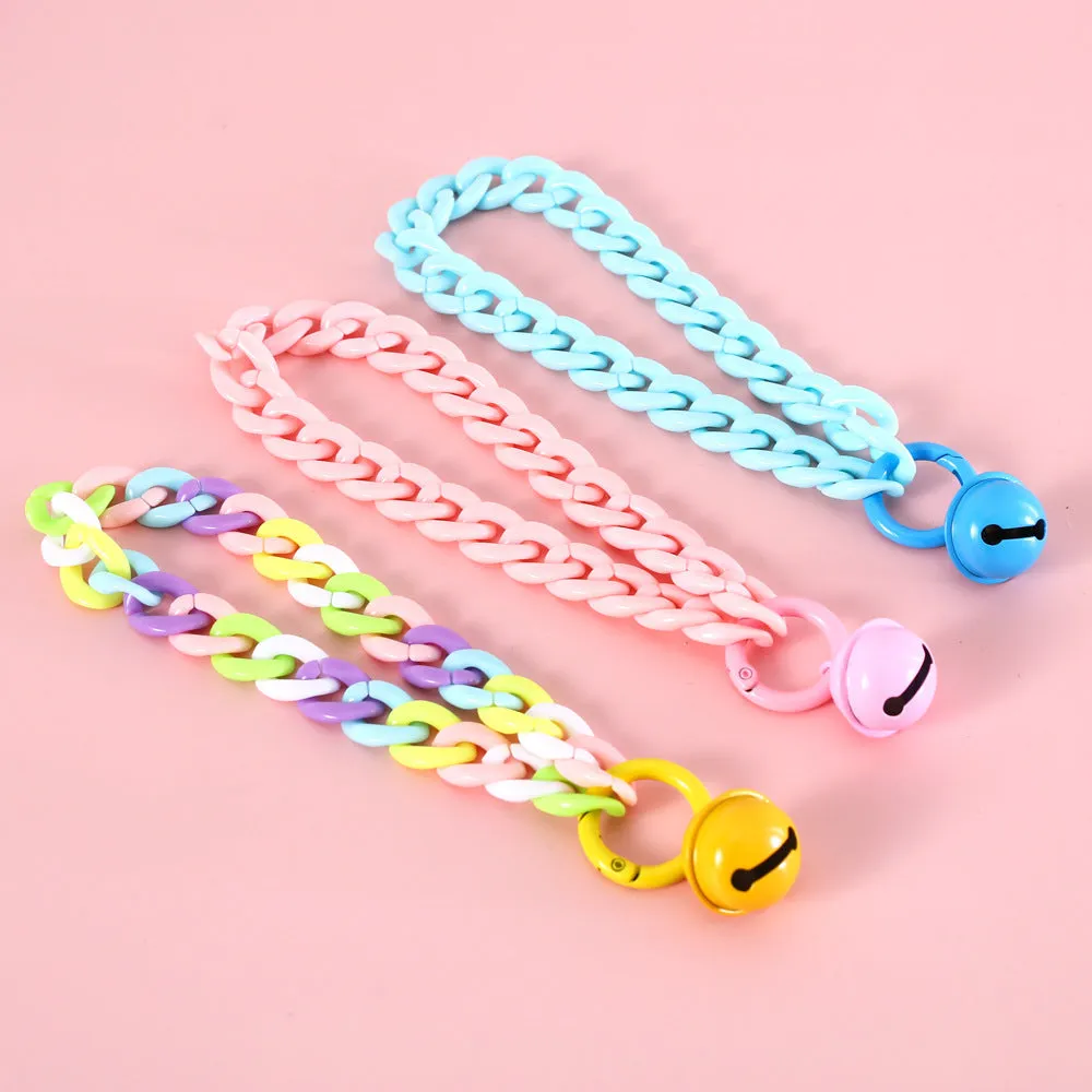 A macaron candy coloured plastic pet collar with chain detailing, shown in blue, pink, and mixed colour options.