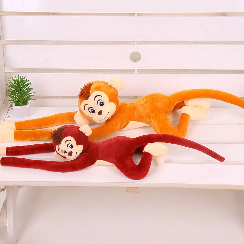 Plush hanging monkey toy with long arms in pink, red, or brown colours for curtain decoration