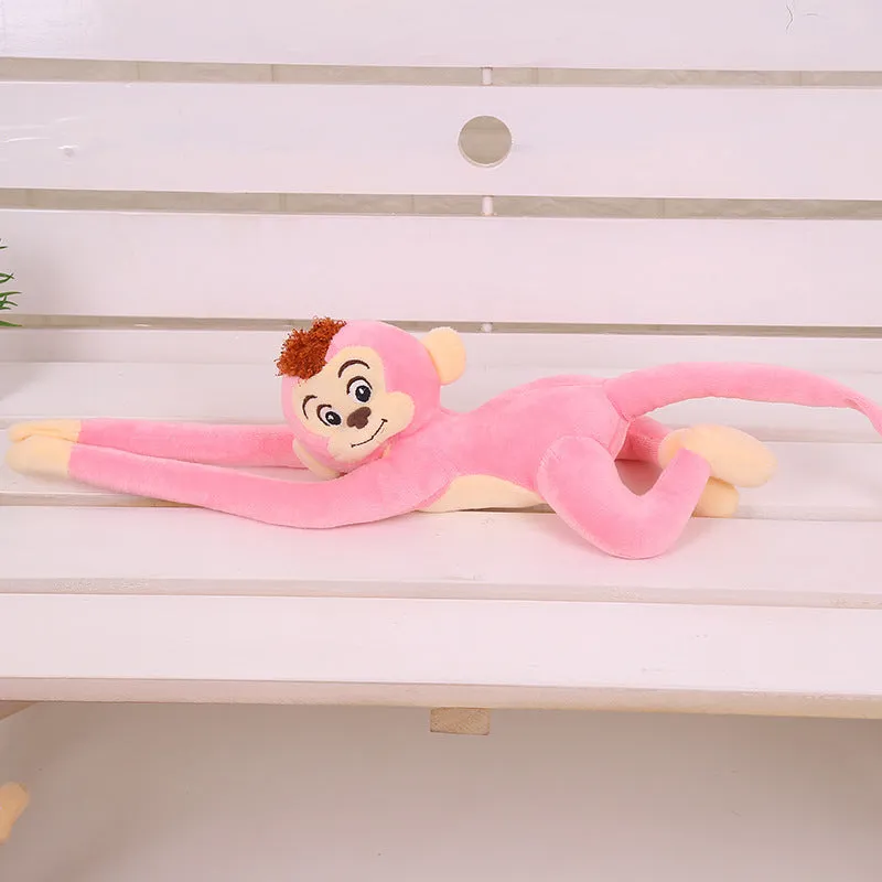 Plush hanging monkey toy with long arms in pink, red, or brown colours for curtain decoration