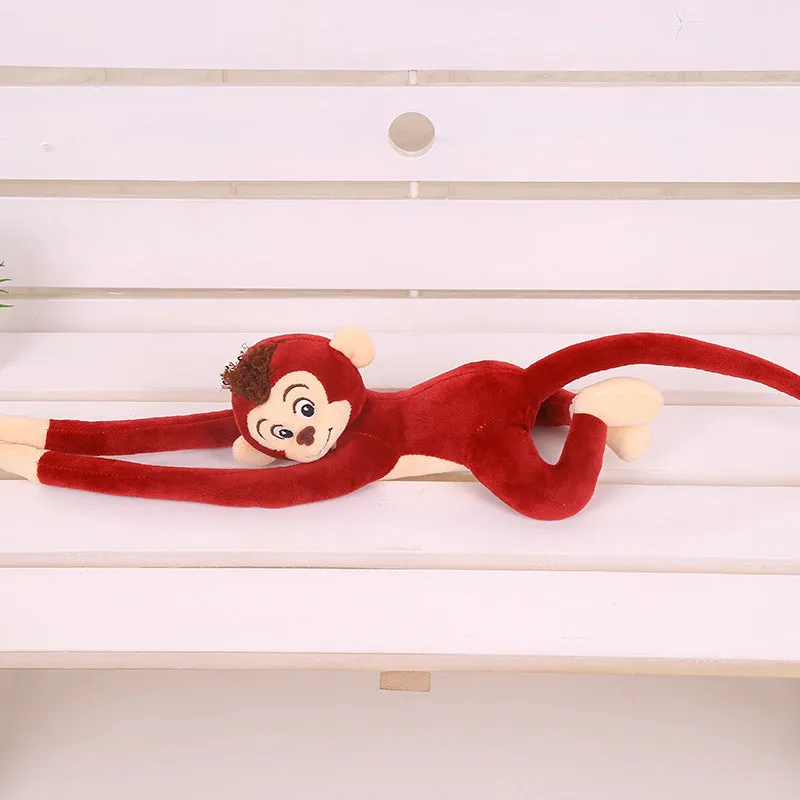 Plush hanging monkey toy with long arms in pink, red, or brown colours for curtain decoration