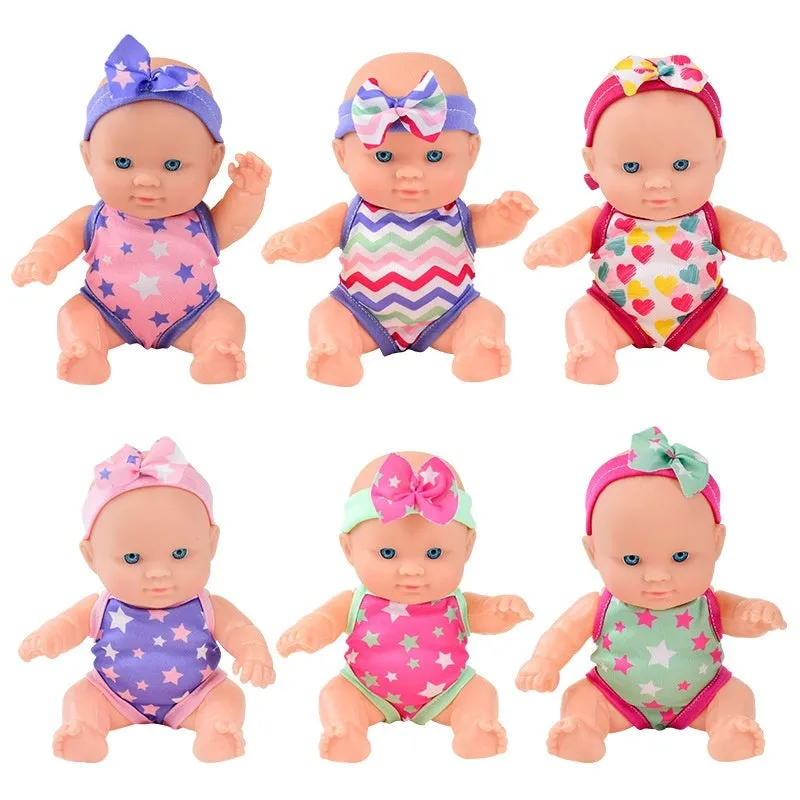 A detailed vinyl simulation baby figurine doll, showing its realistic features and proportions.