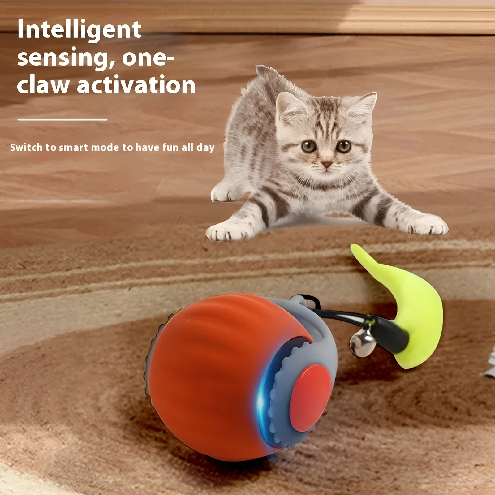 Orange and blue silicone gravity-powered cat toy with rolling ball and gun grip attachment options