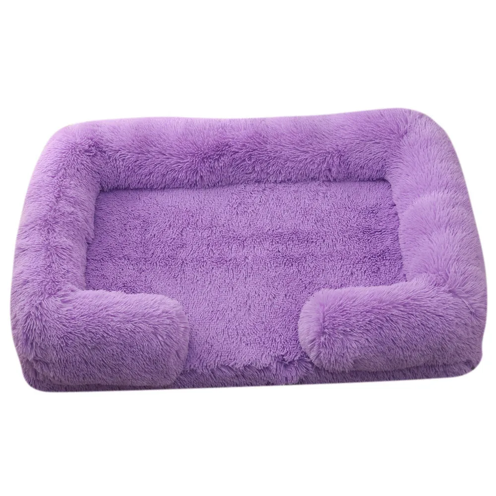 Plush round dog bed in beige brown with raised edges and a removable inner sleeve.