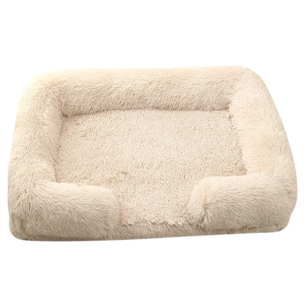 Plush round dog bed in beige brown with raised edges and a removable inner sleeve.