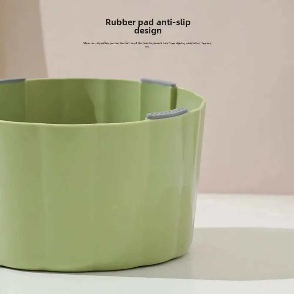 Dark green ceramic cat bowl on a raised cactus-design stand with wide rim and anti-slip base.