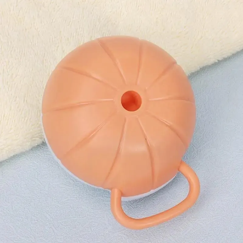 Orange TPR dog shampoo brush with silicone comb teeth and pumpkin-shaped ergonomic handle