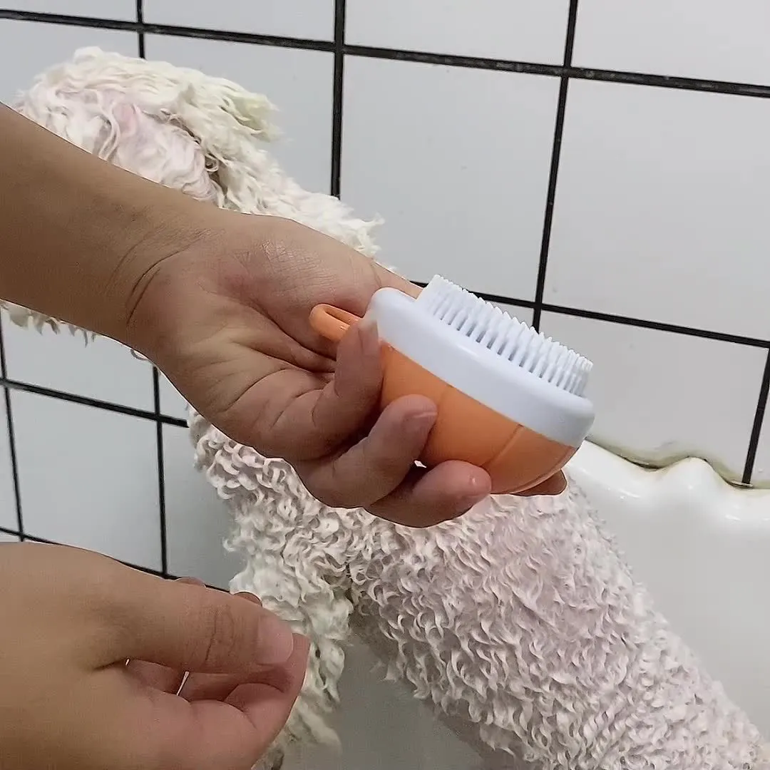 Orange TPR dog shampoo brush with silicone comb teeth and pumpkin-shaped ergonomic handle