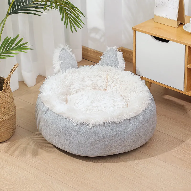 Soft faux fur plush cat bed in grey with fluffy interior – available in multiple sizes and colours for indoor use