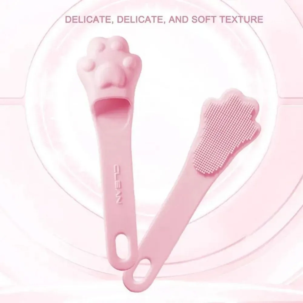 Silicone finger cover toothbrush for dogs and cats in pink, purple, yellow, and white.