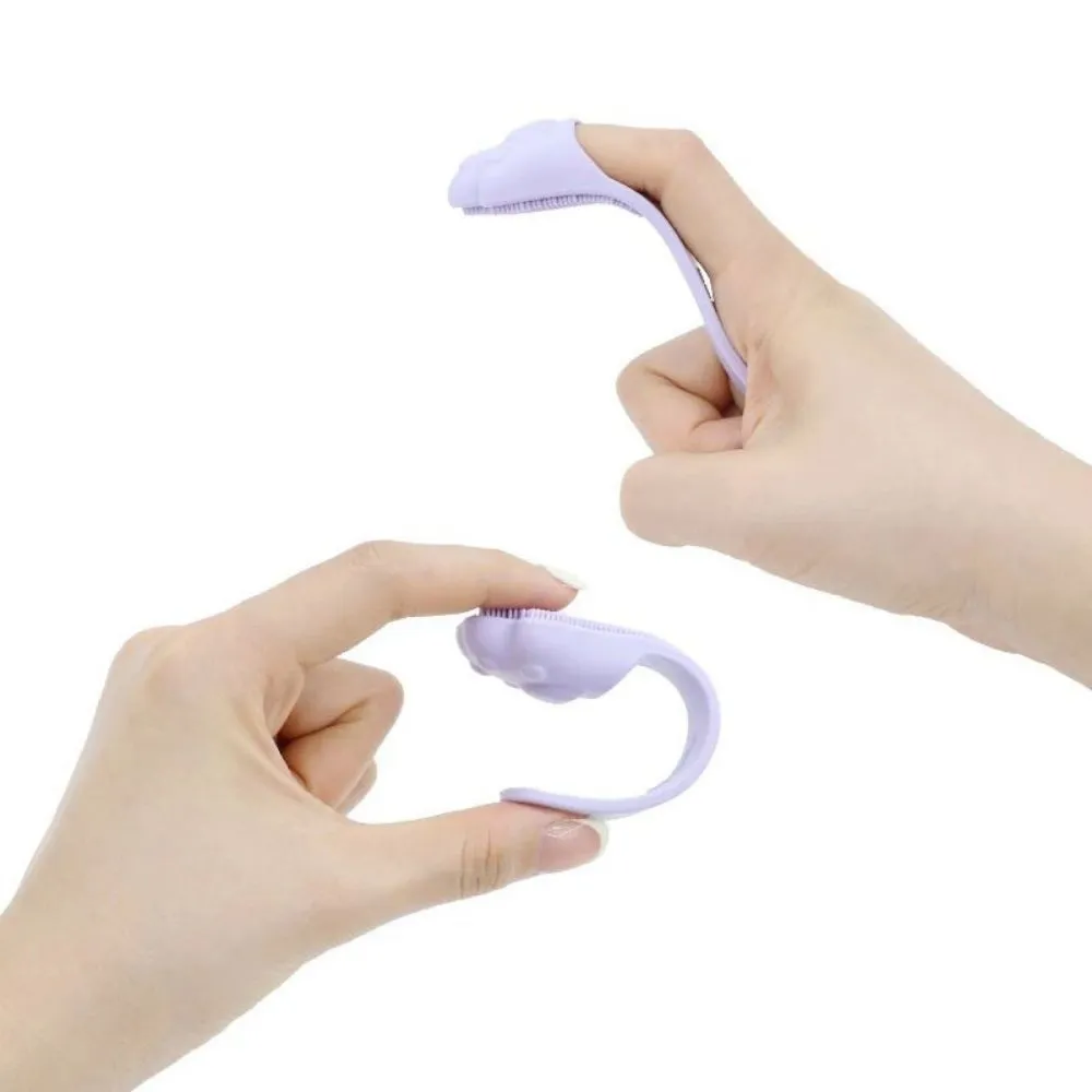 Silicone finger cover toothbrush for dogs and cats in pink, purple, yellow, and white.