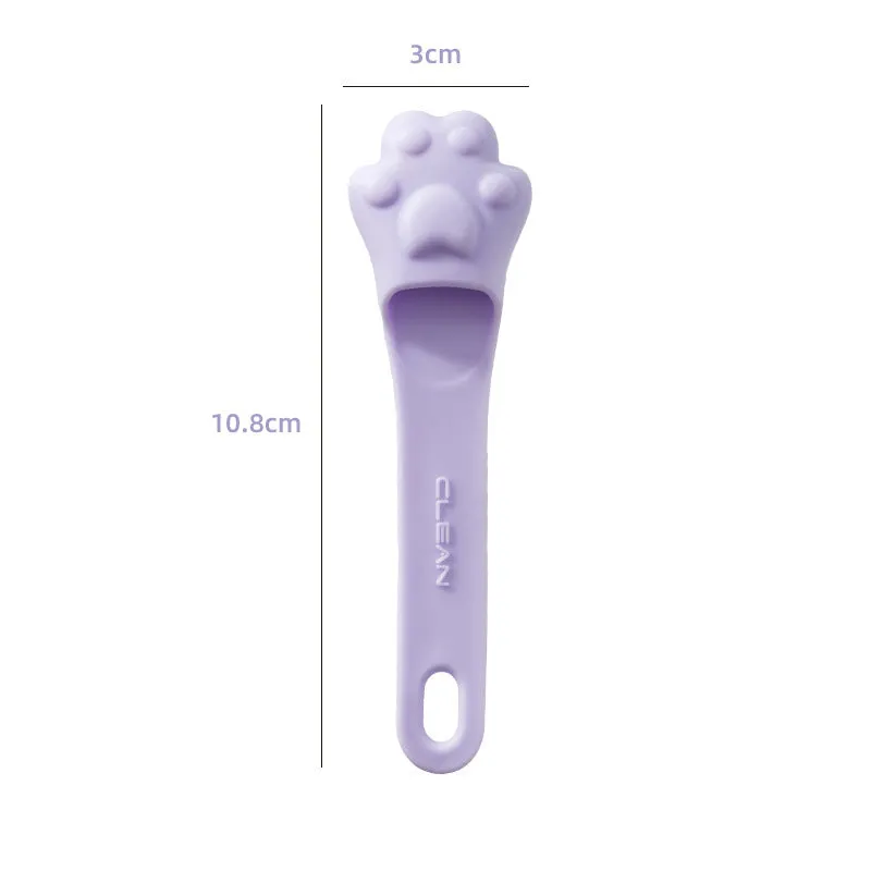 Silicone finger cover toothbrush for dogs and cats in pink, purple, yellow, and white.