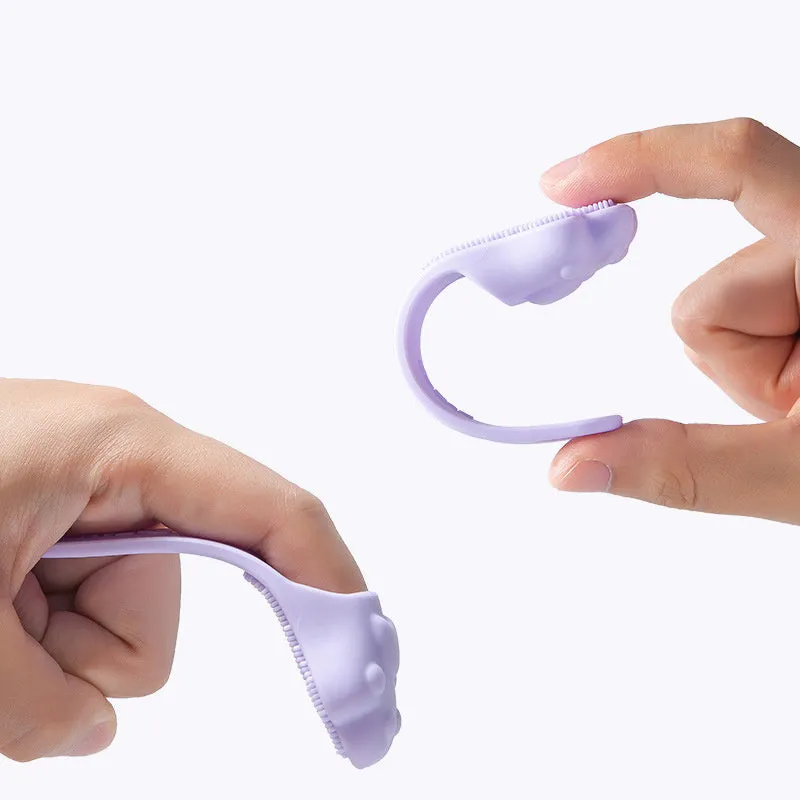 Silicone finger cover toothbrush for dogs and cats in pink, purple, yellow, and white.