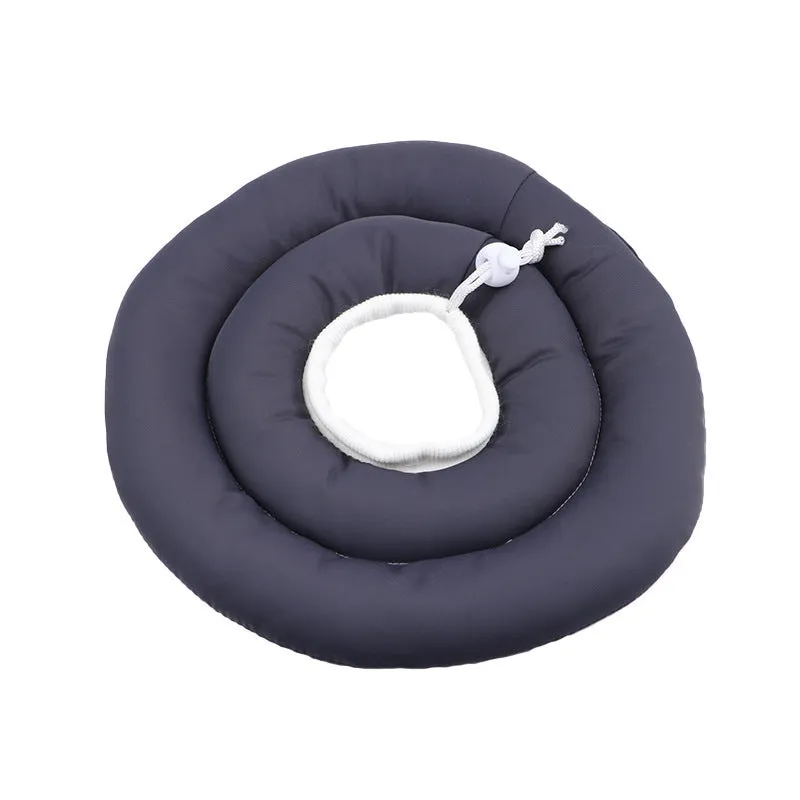 Blue adjustable Elizabethan recovery collar for a dog, showing the spring buckle and padded interior.