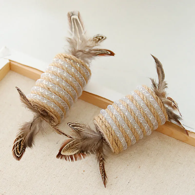 Beige cat toy with real feathers attached to hemp rope scratching surface and integrated claw roller