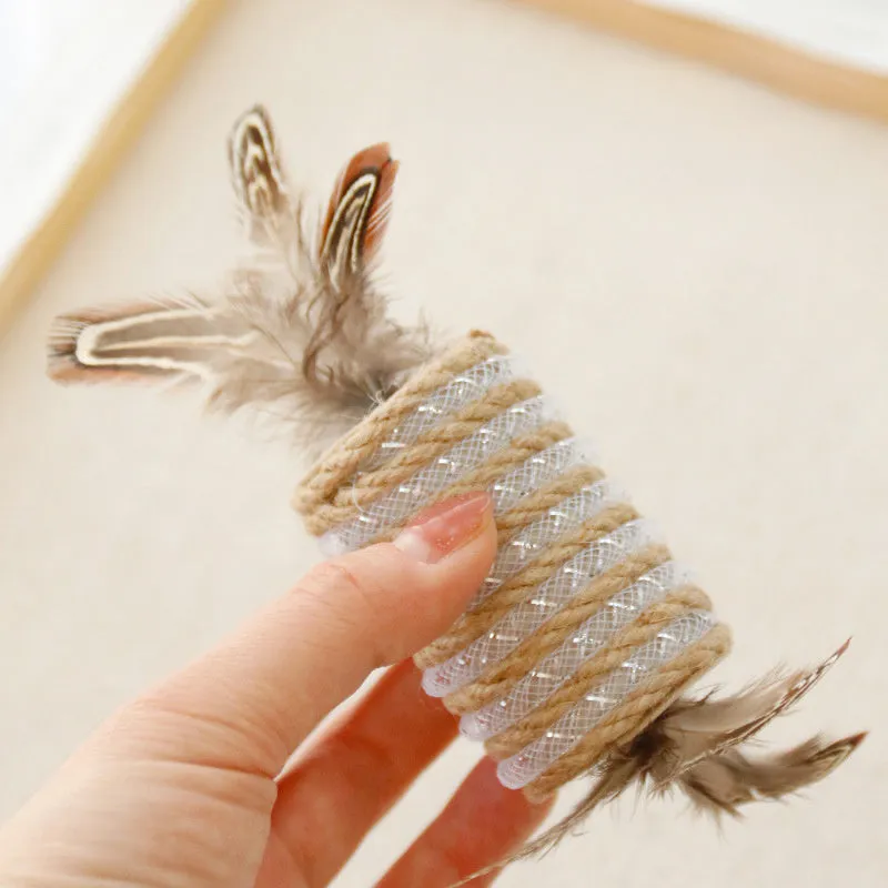 Beige cat toy with real feathers attached to hemp rope scratching surface and integrated claw roller