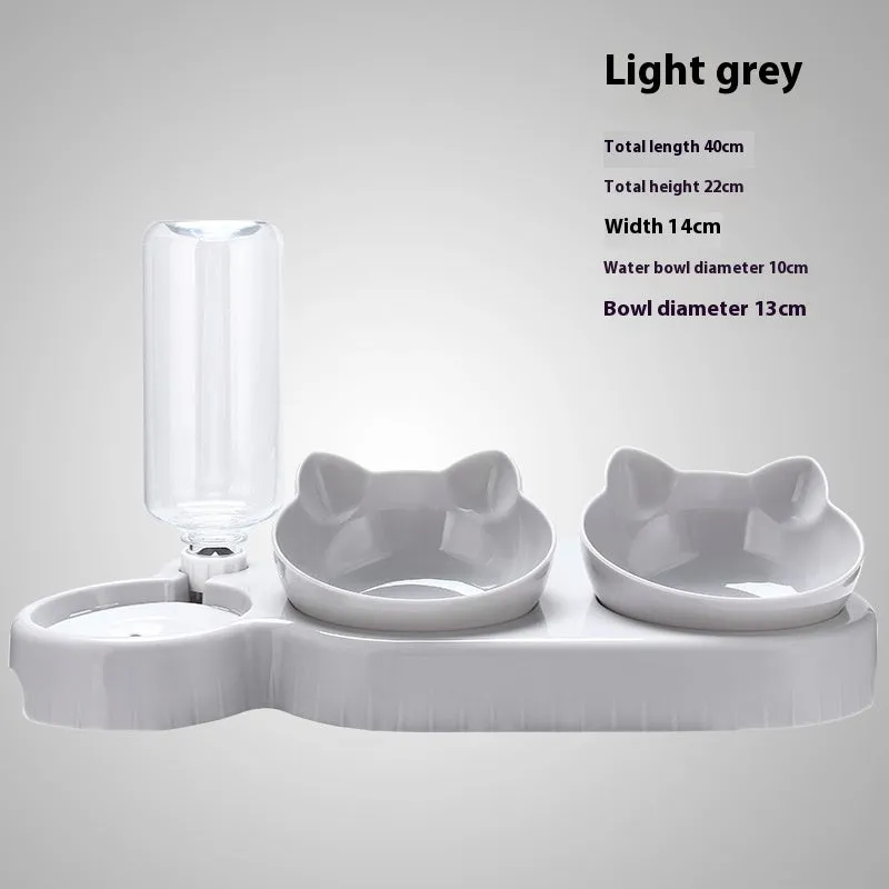 Dark blue plastic double bowl pet feeding set for dogs and cats on a plain background
