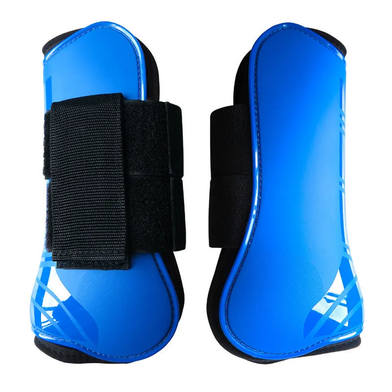 Horse leg guards in PU diving material, close-up on a front leg guard showing red colour and padded construction