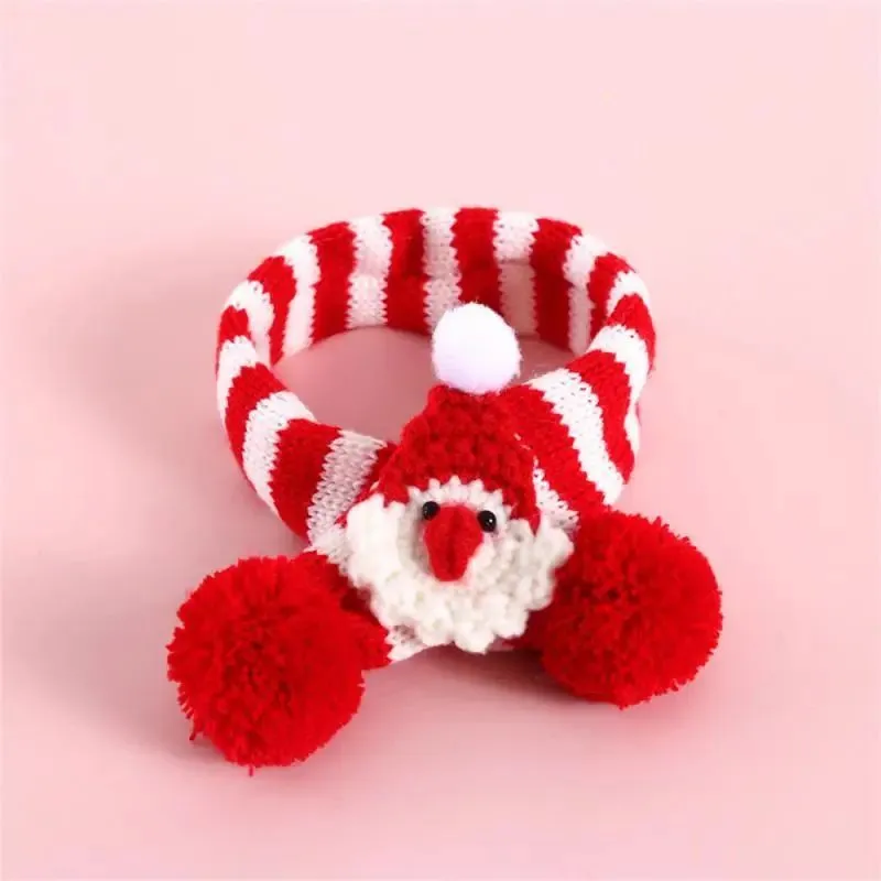Green adjustable knitted scarf collar for a small dog on a white background