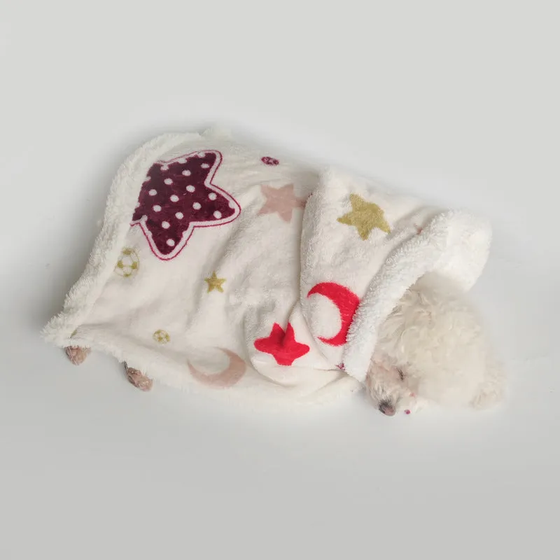 White coral fleece pet pajamas with moon and stars pattern on a light background, size M