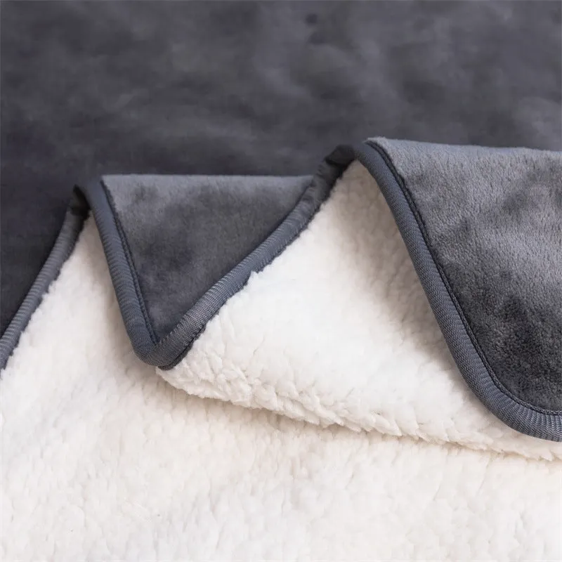 Lambswool waterproof dog blanket in grey, folded to show size and cloth texture.
