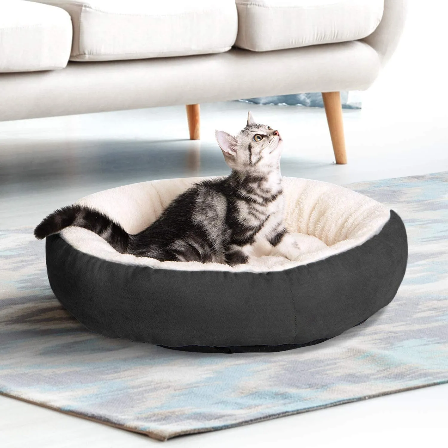 Circular soft cloth pet bed nest in blue colour showing raised edges and nesting area
