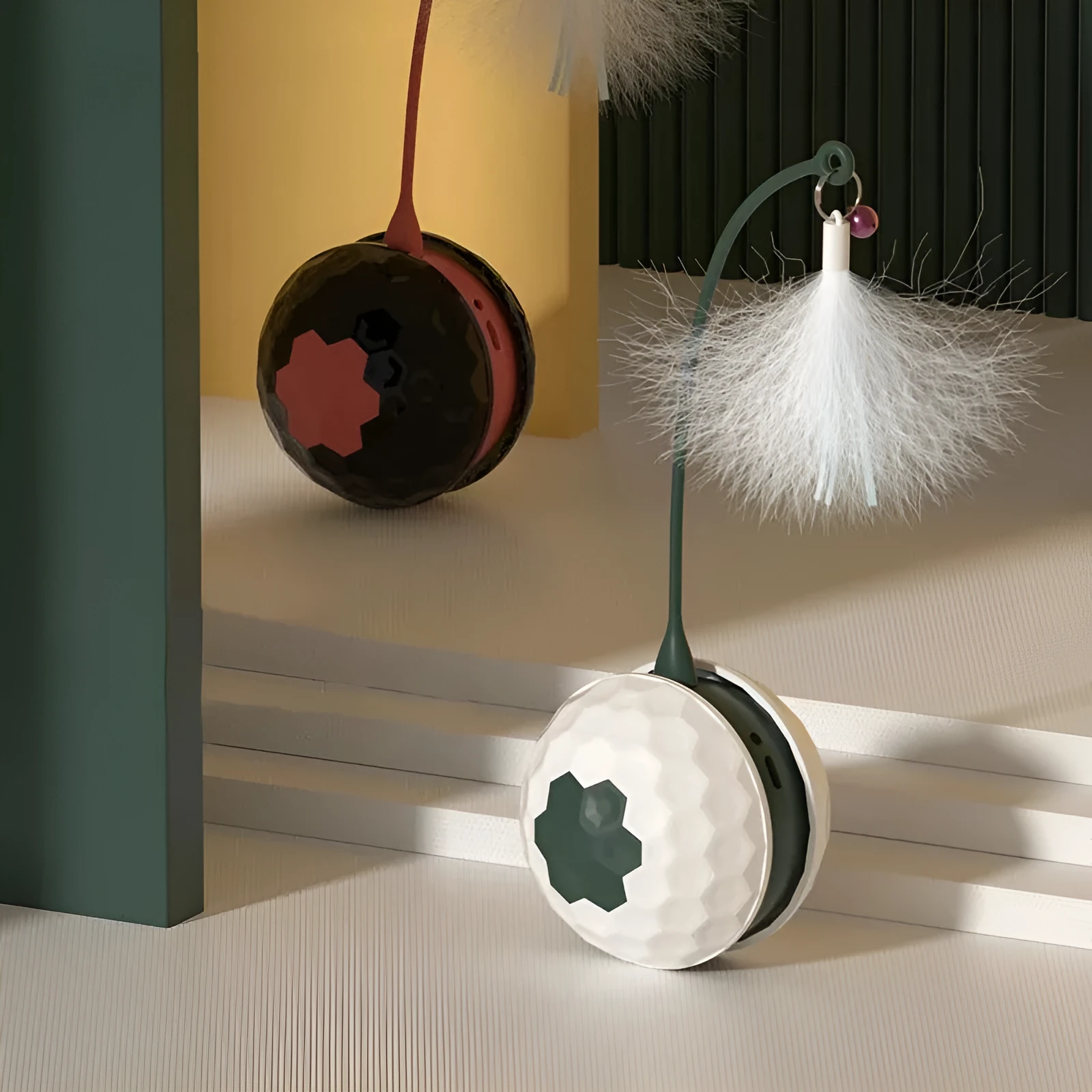 Red automatic cat toy with feather attachment showing tumbler design and USB charging port