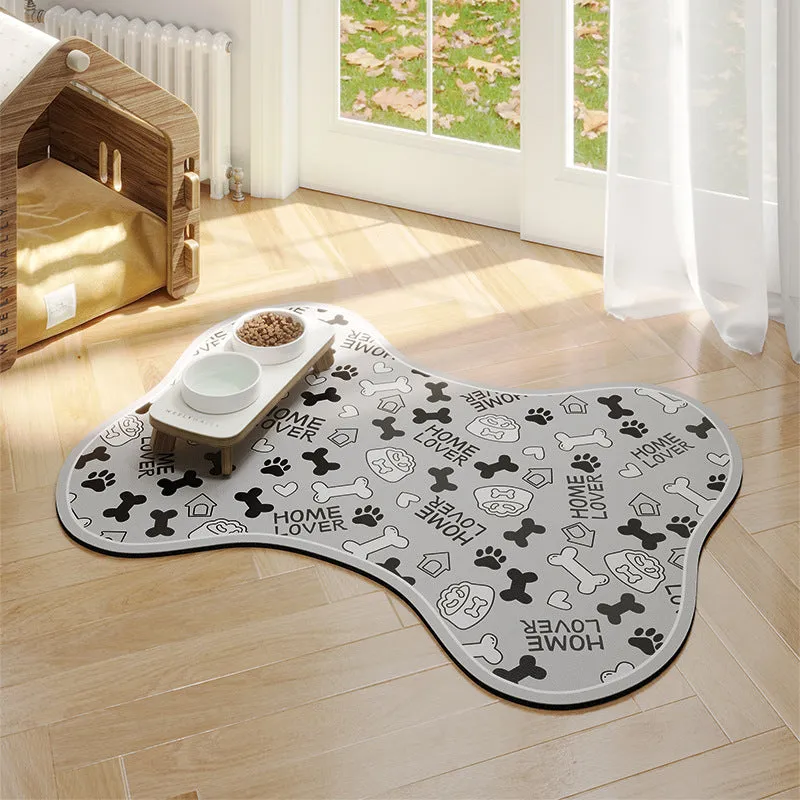 Pet feeding mat with non-slip backing in a dog paw print design on a hardwood floor.