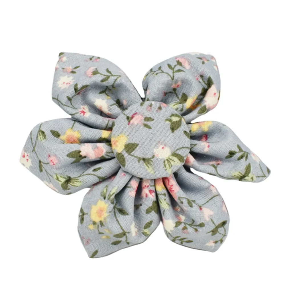 Blue floral patterned adjustable dog collar with matching leash, bow, and vest on a white background.