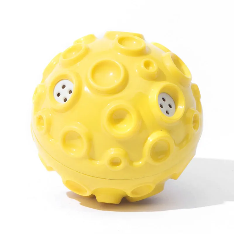 Colourful durable dog chew ball with textured surface and internal squeaker for aggressive chewers