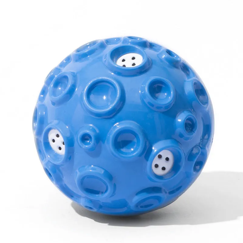 Colourful durable dog chew ball with textured surface and internal squeaker for aggressive chewers