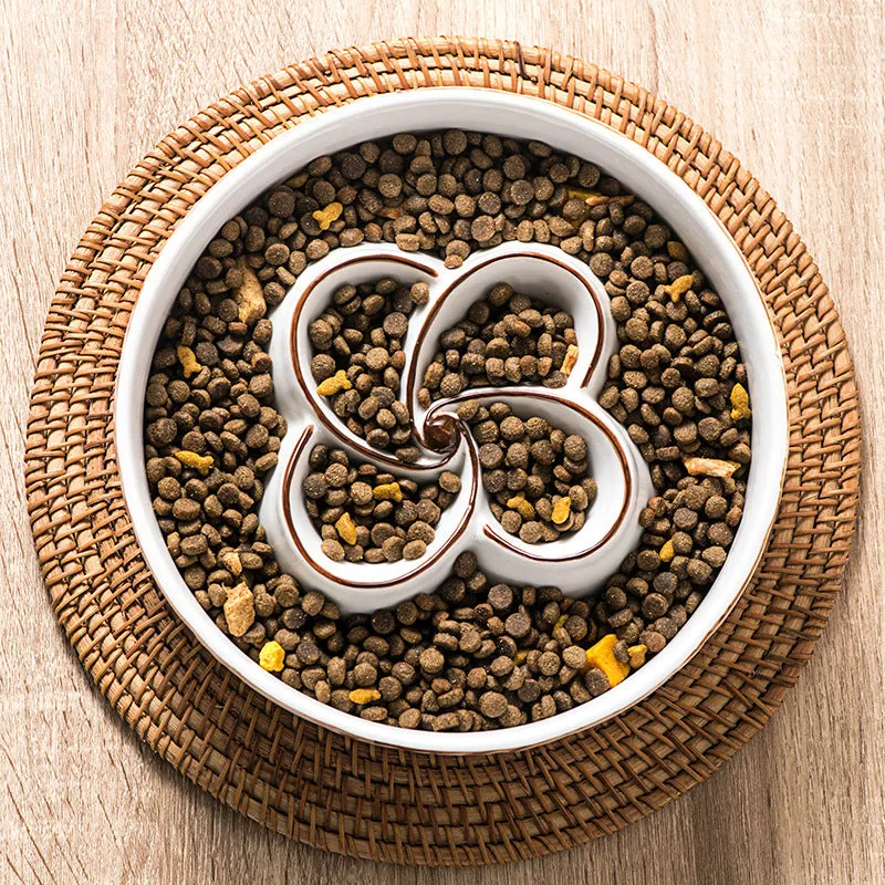 Blue ceramic slow feeder dog bowl with maze pattern and non-slip rubber base for large dogs.