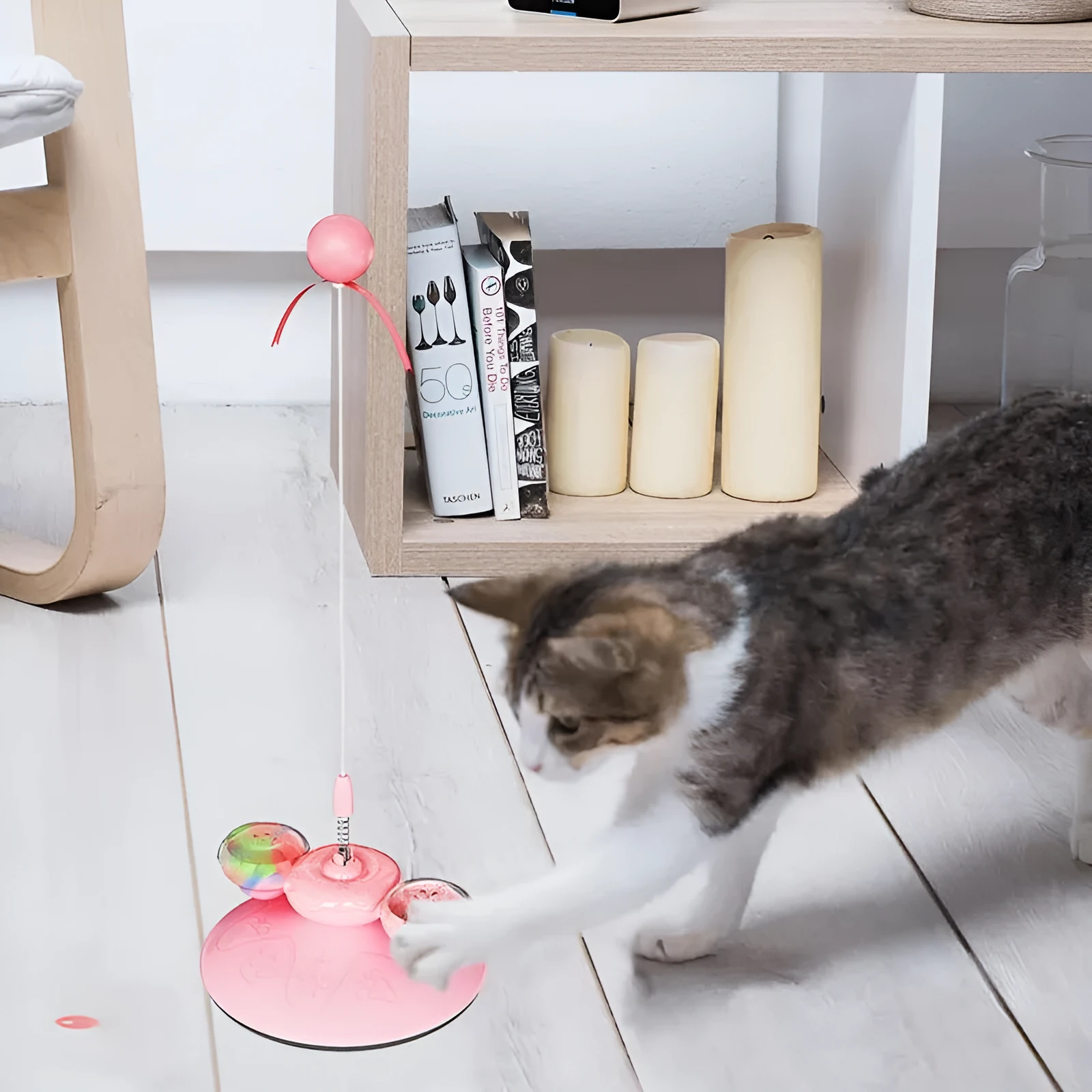 Cat interactive toy with suction cup base and colourful LED lights on spring mechanism