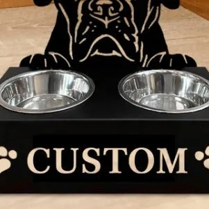 Personalised wrought iron dog bowl rack with custom name, 33x17x7cm, holding a metal dog bowl