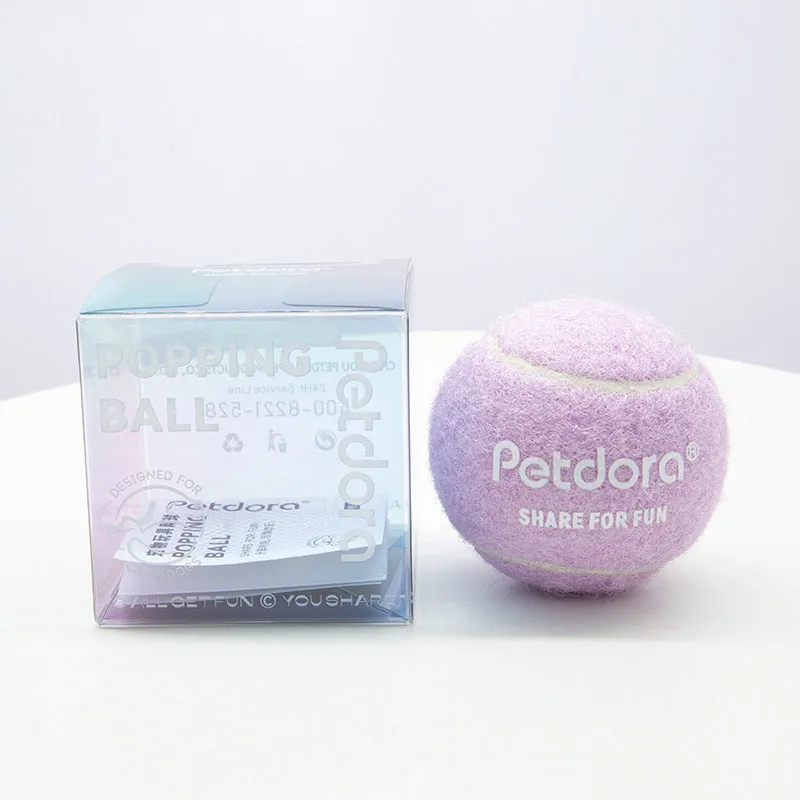 Dog toy high elastic macaron pet tennis ball in ice crystal blue on white background