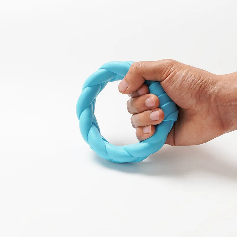 Blue rubber woven ring dog toy for teeth cleaning and interactive training on a plain background