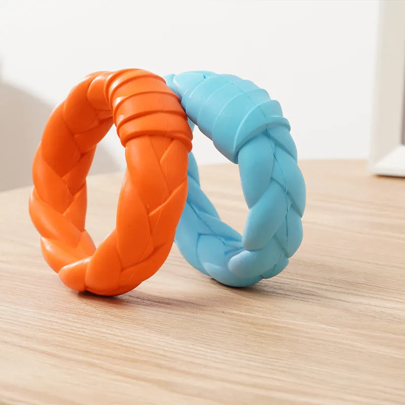 Blue rubber woven ring dog toy for teeth cleaning and interactive training on a plain background