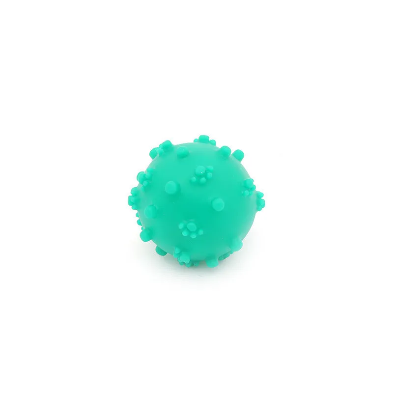 Bright blue, green, pink, and yellow squeaky dog toy balls with a spiky texture and paw print dimples.
