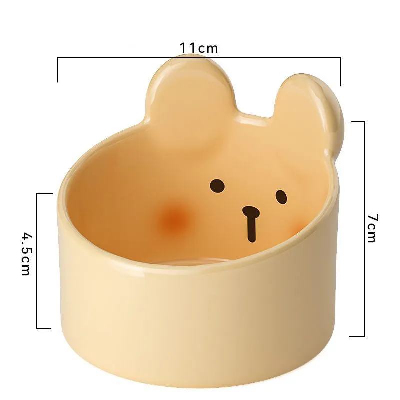White ceramic pet food bowl with slant design on a plain surface