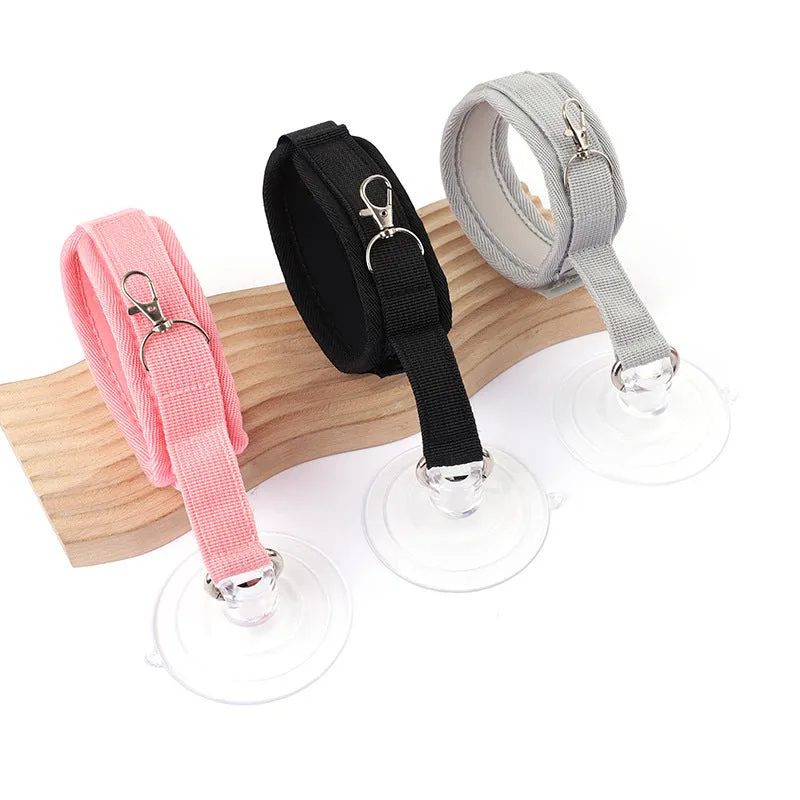 Adjustable fabric pet bathing restraint collar with suction cup in black, grey, and pink