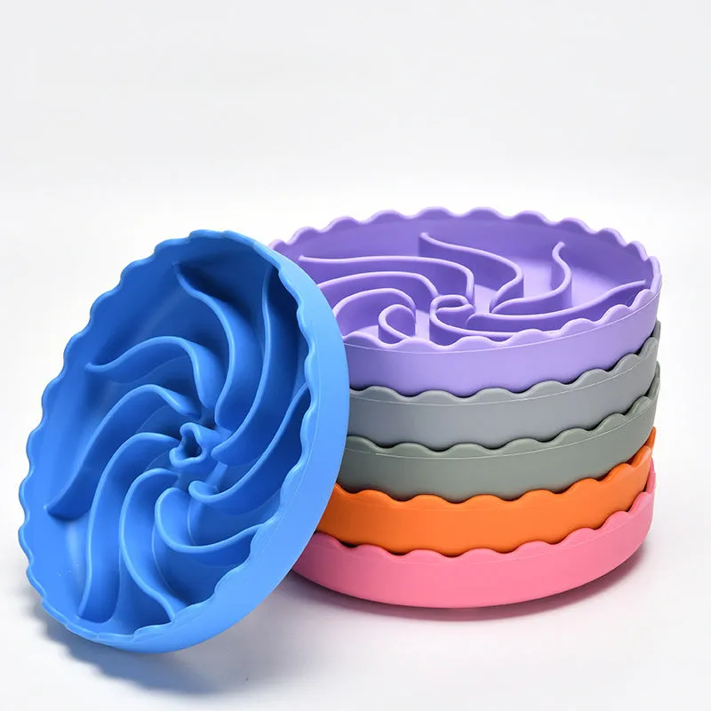 Food-grade silicone slow feeder dog bowl in blue with suction cup base and raised maze ridges