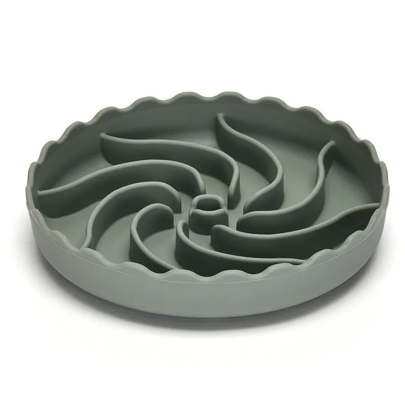 Food-grade silicone slow feeder dog bowl in blue with suction cup base and raised maze ridges