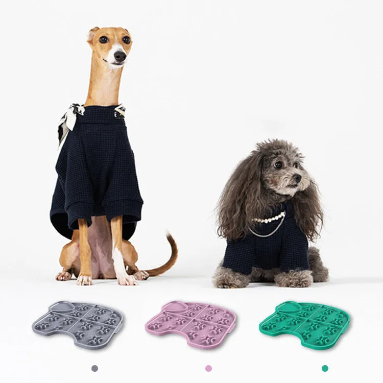 Gray silicone pet slow food pad with suction cups under a pet bowl
