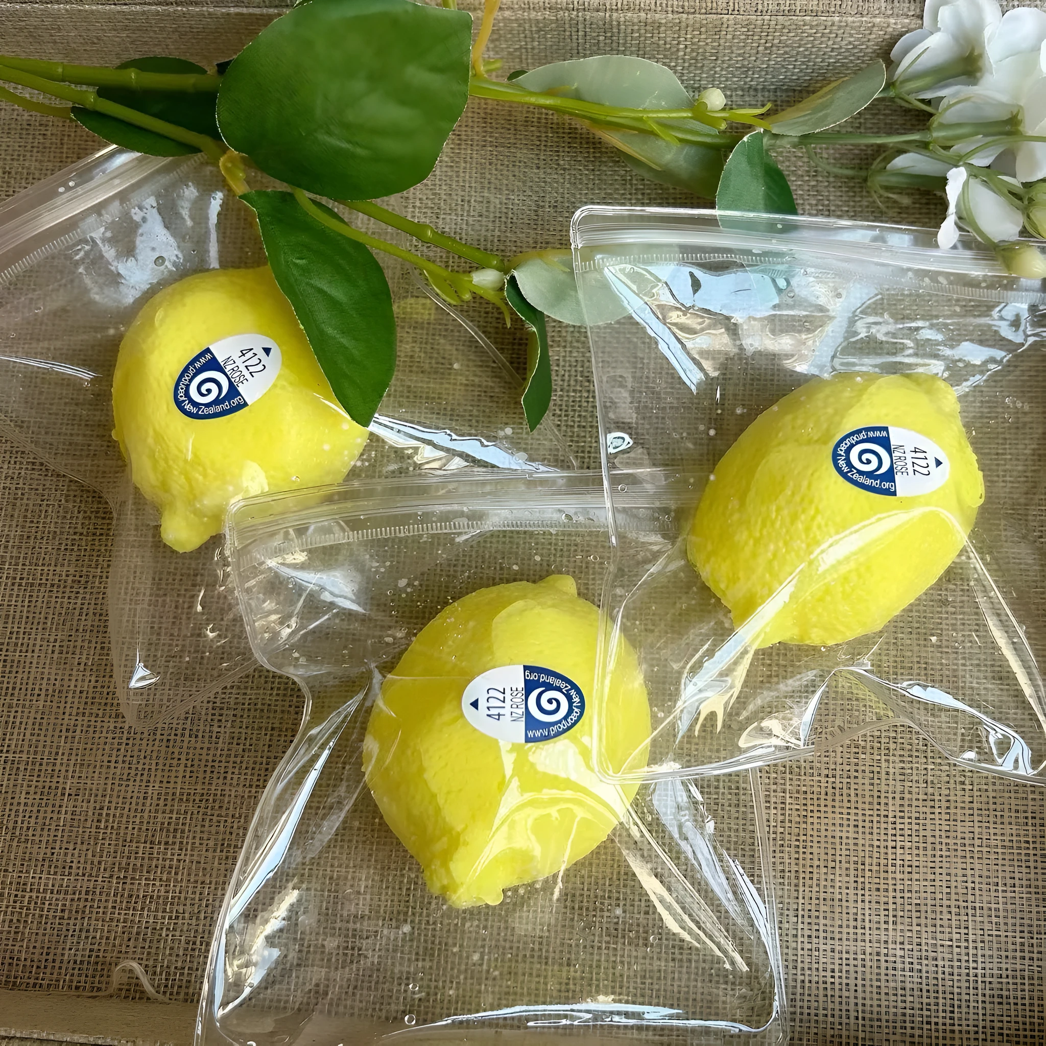 Yellow silicone lemon squeezing toy on a flat surface used for stress relief and sensory play